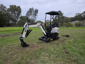 Mini excavator digging on site