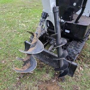 Mini skid steer carrying pallet forks