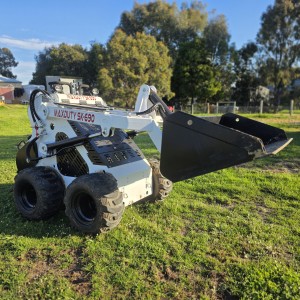 Mini skid steer with general purpose bucket